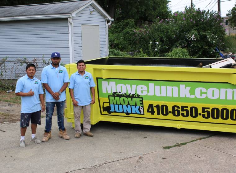 Move Junk employees next to a dumpster